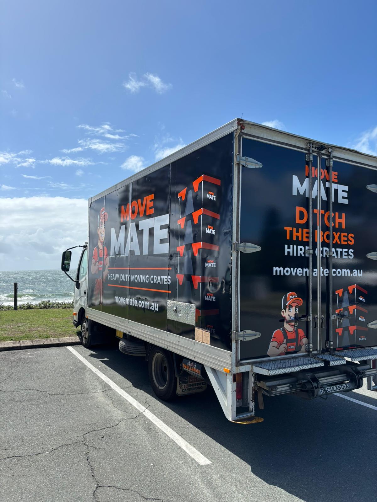Move Mate truck parked on a coastal road